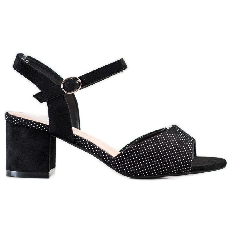 Schwarze Sandalen auf einer Bar Sergio Leone