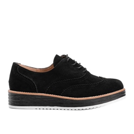 Schwarze Wildlederschuhe auf einer hohen Kenia-Sohle