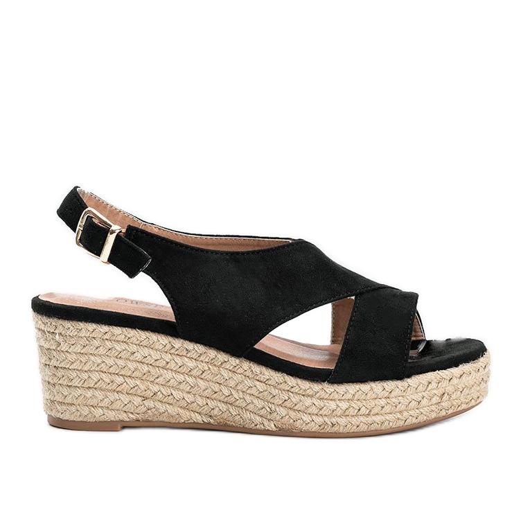 Schwarze Espadrilles auf dem Keil von Marina