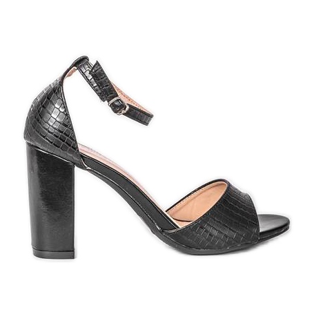 Schwarze Sandalen auf einem Milano-Pfosten