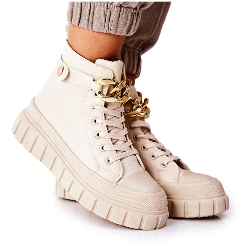 Hohe Sneakers auf beiger Standies-Plattform golden