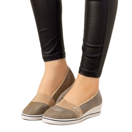 Goldene Turnschuhe mit Keilabsatz von Burris