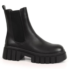 Schwarze Chelsea-Stiefel für Damen auf der Plattform, isolierter schwarzer Sergio Leone