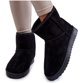 Isolierte schwarze Schneestiefel der Frauen von Frauen