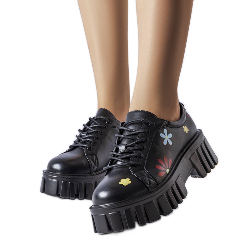 Schwarze Brogues mit Zwillingsblumen verziert