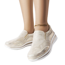 Goldene Turnschuhe mit durchbrochenem Keilabsatz von Rhéaume