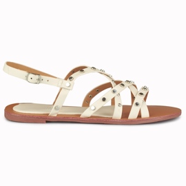 Beigefarbene Damensandalen mit Metallverzierungen