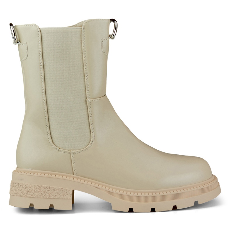 Klassische beige Damenstiefel auf der Plattform