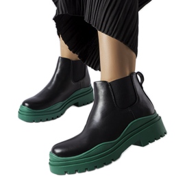 Schwarze Stiefeletten auf einem farbenfrohen Marinone-Plateau