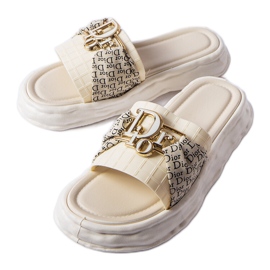 Dekorative Pantoletten aus beigem Gummi von Bérard