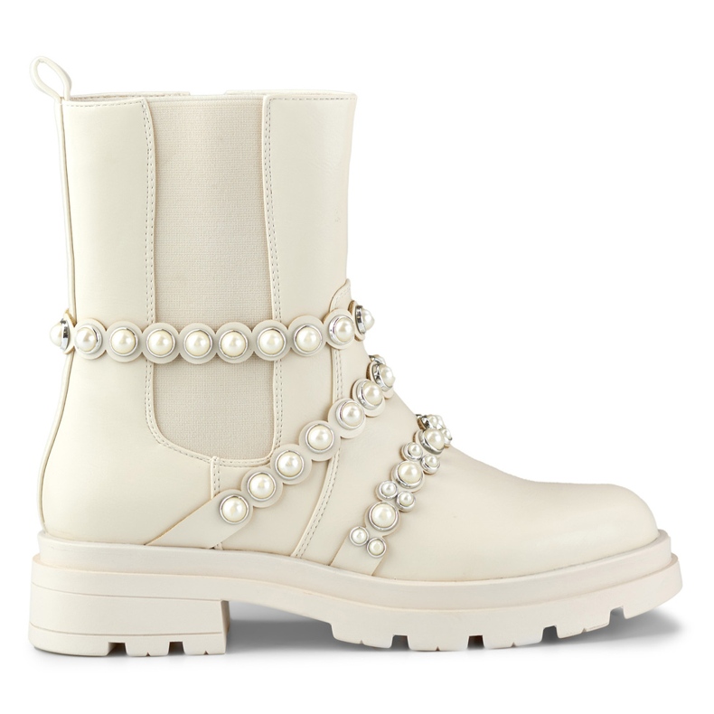 Beigefarbene Damenstiefeletten mit dekorativen Accessoires