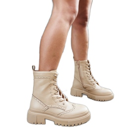 Beigefarbene Stiefel mit Nicla-Nähten verziert schwarz