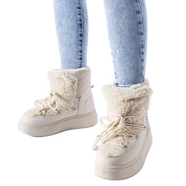 Beigefarbene Schneestiefel auf einer massiven Elvio-Plattform