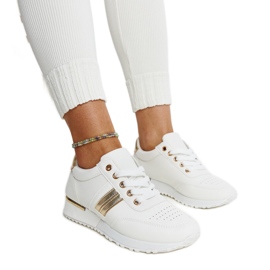 Weiß-goldene Sneakers auf der Nihad-Gummiplattform