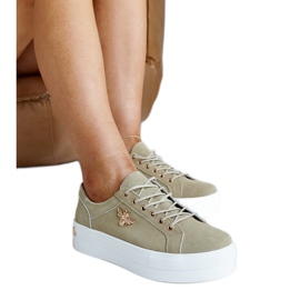 Grüne Sportschuhe aus Leder mit Verzierung