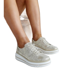 Sneakers mit Keilabsatz aus Pianogold-Leder golden