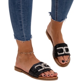 Schwarze Flip-Flops mit dekorativer Schnalle von Rochaela