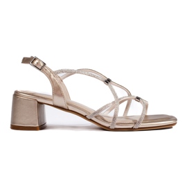 Goldene Damensandalen mit dekorativen Riemen von Sergio Leone