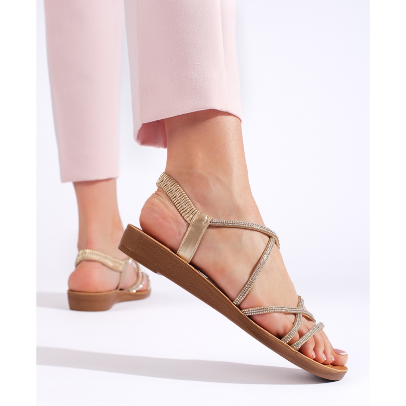 Goldene Slip-On-Sandalen mit Strasssteinen