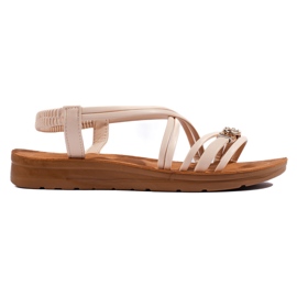 Beige flache Sandalen mit Verzierung