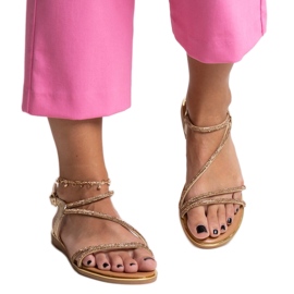 Goldene Sandalen, verziert mit Caramella-Zirkonen