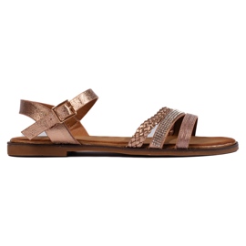 Goldene flache Damensandalen