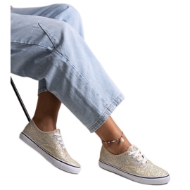 Goldglänzende Turnschuhe von Merri golden