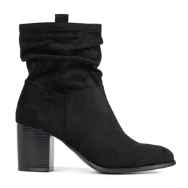 Schwarze Wildlederstiefel für Damen am Pfosten