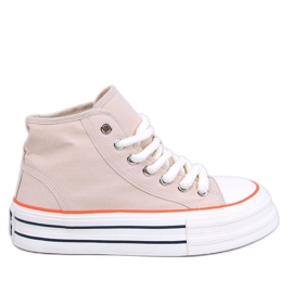 Damenturnschuhe auf der beigen Plattform