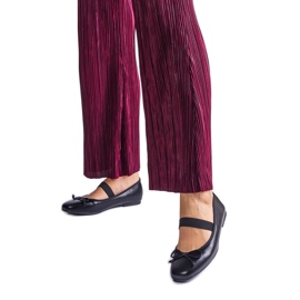 Schwarze Ballerinas mit Gummiband und Zierschleife