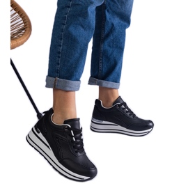 Schwarze Plateau-Sneaker, verziert mit Glitzer und einem metallischen Einsatz