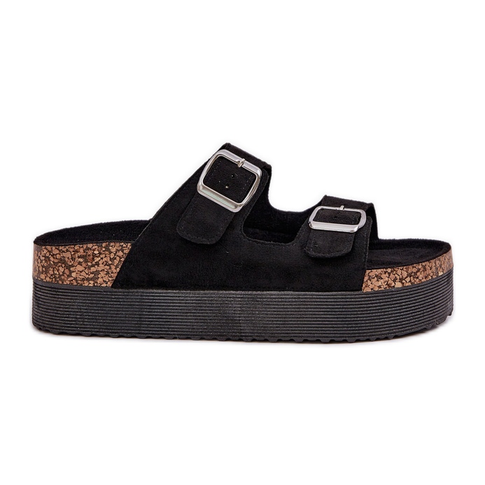 Damenschuhe auf einer massiven Plattform mit schwarzen Schnallen