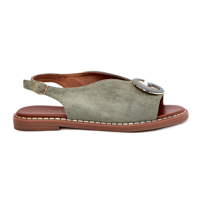 Flache Sandalen mit einer grünen Verzierung