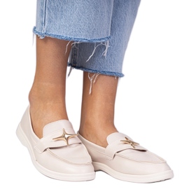 Beige Frauenlehre mit einer goldenen Dekoration