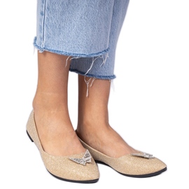 Glitzer Ballerinas für Goldene Frauen mit einem Schmetterling