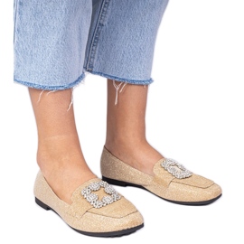 Goldene Glitzer -Laräger mit Zirkonen