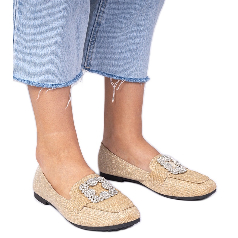 Goldene Glitzer -Laräger mit Zirkonen