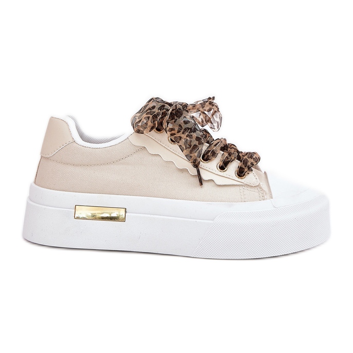 Frauen -Sneaker auf einer massiven Plattform mit dekorativem Schnürsenkel Beige