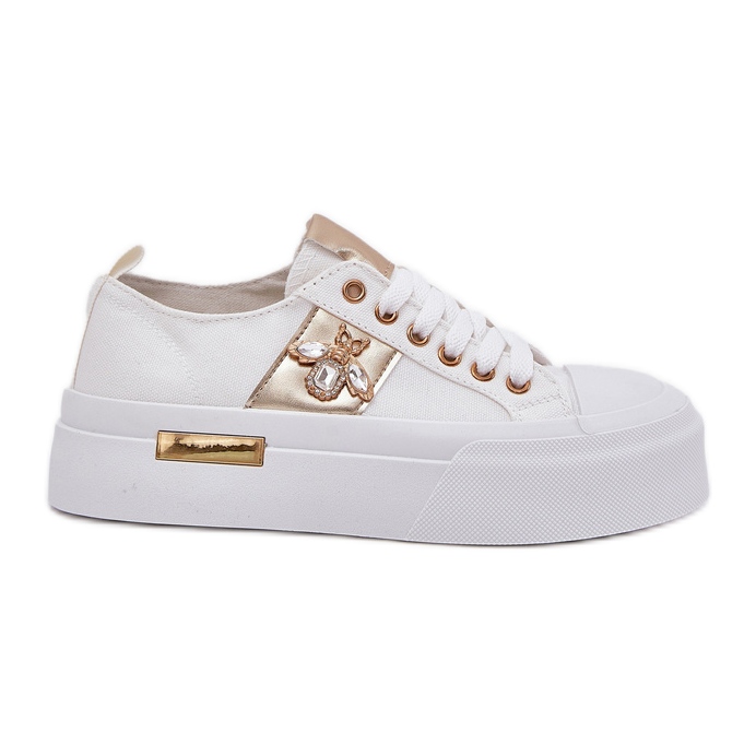 Frauen -Sneaker auf der Plattform mit einem dekorativen Detail weiß