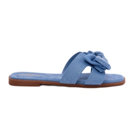 Flat -Frauen -Flip -Flops mit einem blauen Bogen