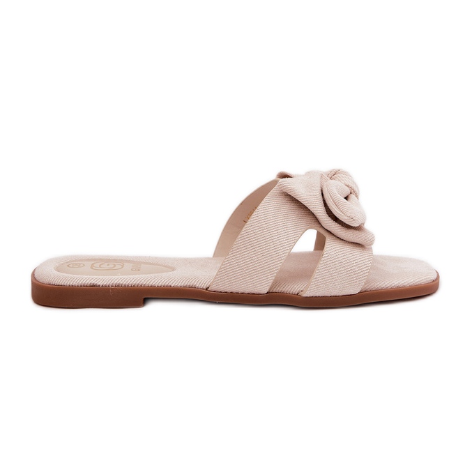 Flat -Frauen -Flip -Flops mit einem Bogen Beige