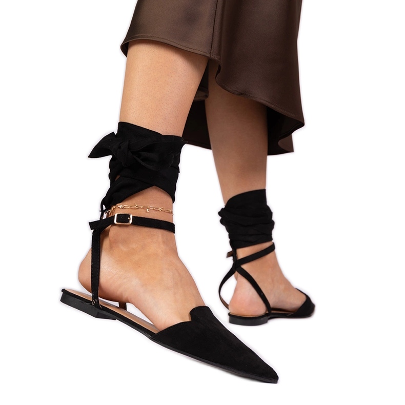 Schwarze flache Absätze