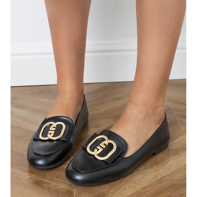 Schwarze Frauen -Slipper mit goldener Dekoration
