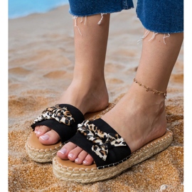Schwarze Espadrilles mit einem Bogen