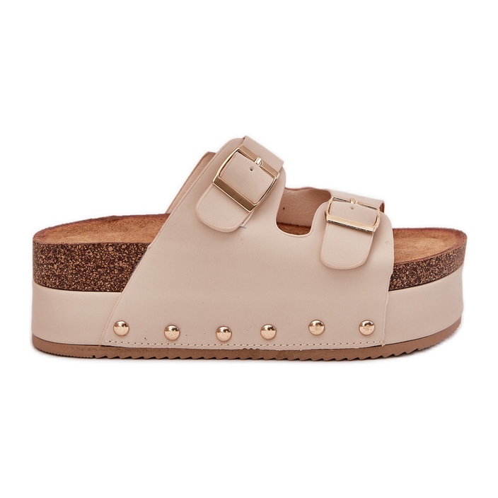 Die Flips von Frauen flops mit Schnallen auf einer massiven Plattform Beige