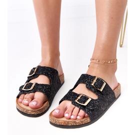 Schwarze Glitzer -Flip -Flops auf der Korkensohle der Flotte