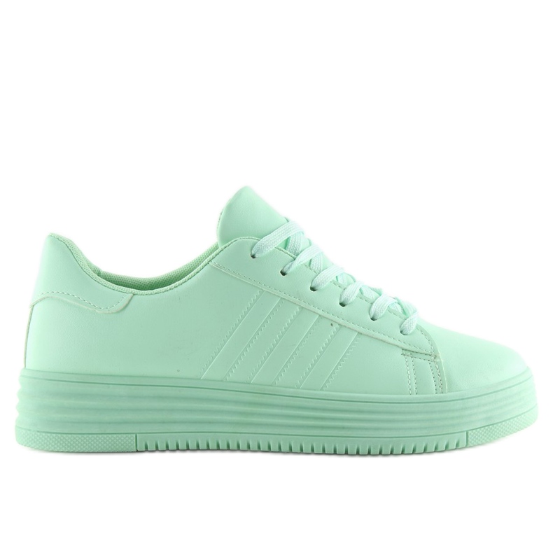 Grüne Turnschuhe mit hohen Sohlen