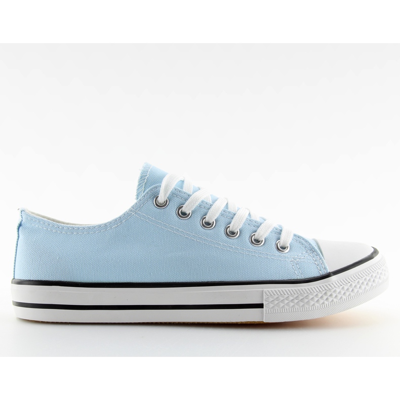 Klassische blaue Turnschuhe der Frauen blau