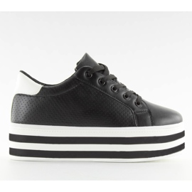 Schwarze schwarze Turnschuhe mit hoher Sohle