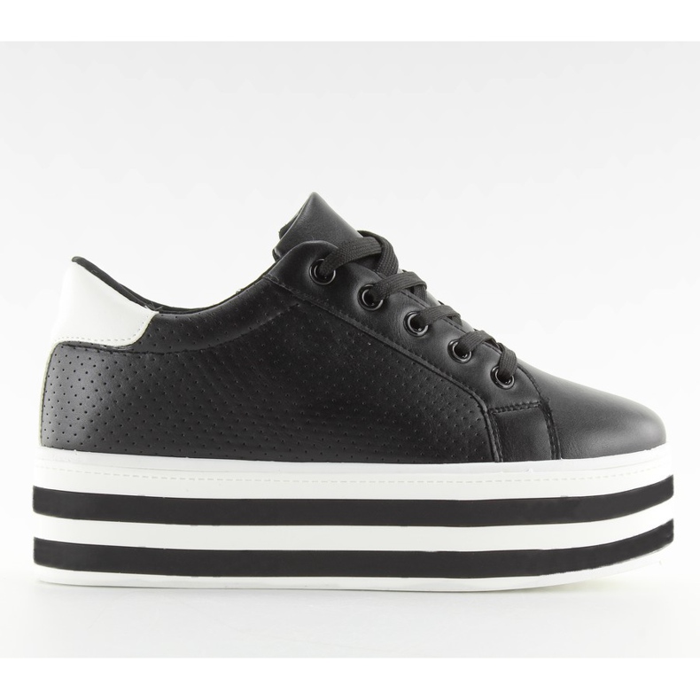 Schwarze schwarze Turnschuhe mit hoher Sohle